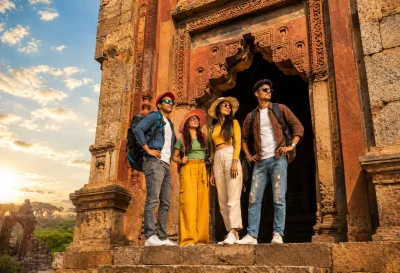 Friends Exploring Ancient Heritage Monument at Golden Hour | AI Travel Image